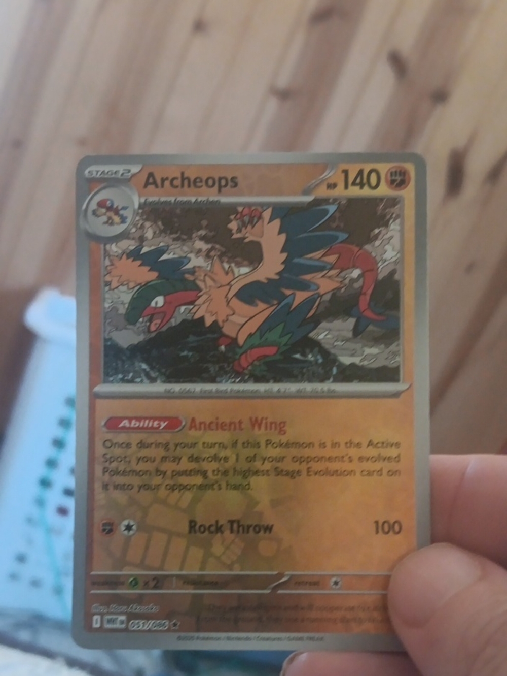 Pokemon Archeops Trading Card - Orange and Green Artwork